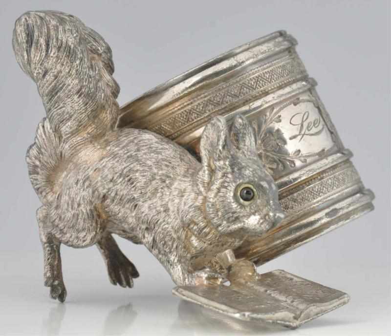 Appraisal: Squirrel with Glass Eyes Figural Napkin Ring Squirrel sings with