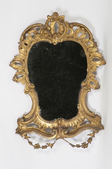 Appraisal: A GEORGE III STYLE GILTWOOD WALL MIRROR of cartouche shape