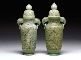 Appraisal: PAIR OPENWORK CARVED JADE URNS Pair one slightly larger superbly