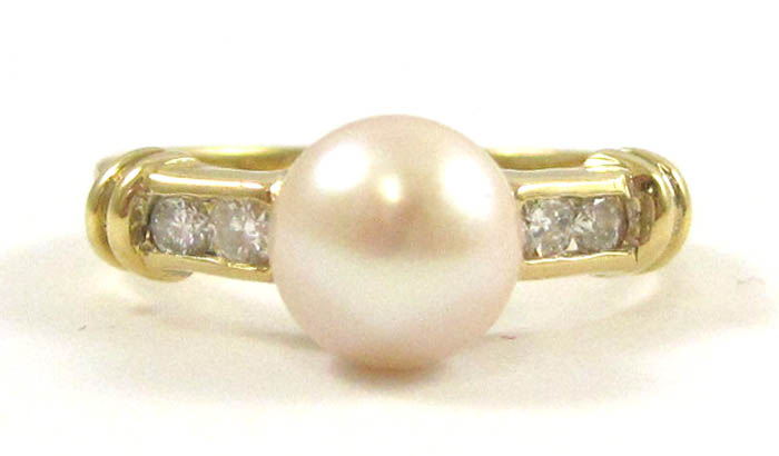 Appraisal: PEARL DIAMOND AND EIGHTEEN KARAT GOLD RING with two round-cut