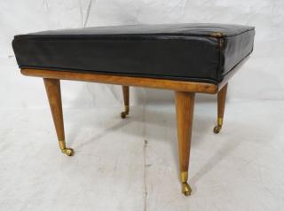 Appraisal: Black Leather Mid Century Modern Rolling Ottoman Wood frame and