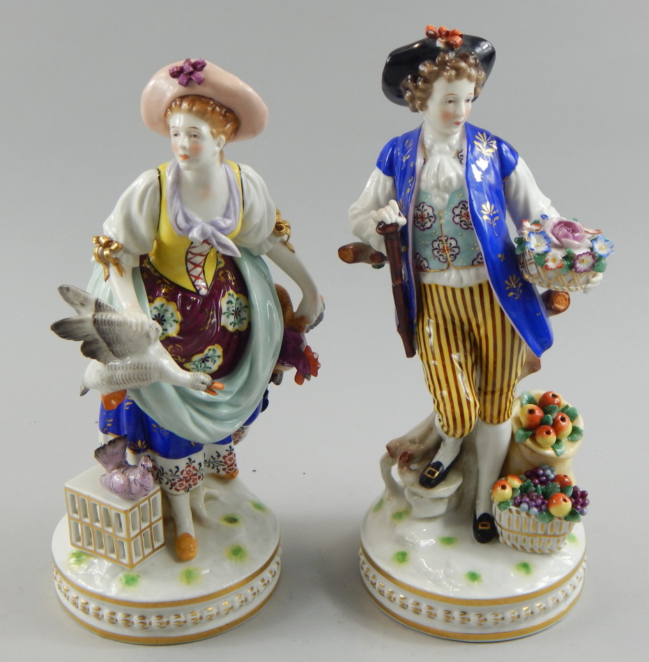 Appraisal: A pair of German porcelain figures one a female figure