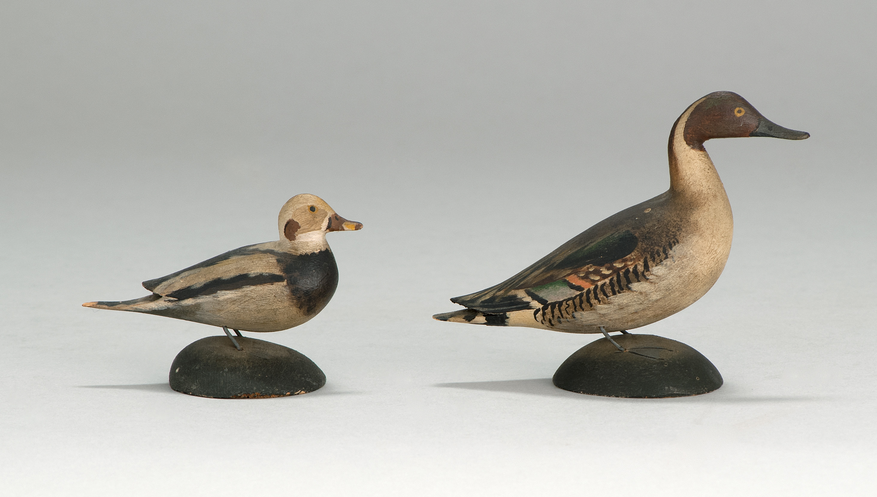 Appraisal: TWO MINIATURE BIRD CARVINGS Circa An old squaw drake and