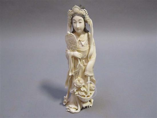 Appraisal: IVORY CARVED FIGURE A woman holding a fan in raised