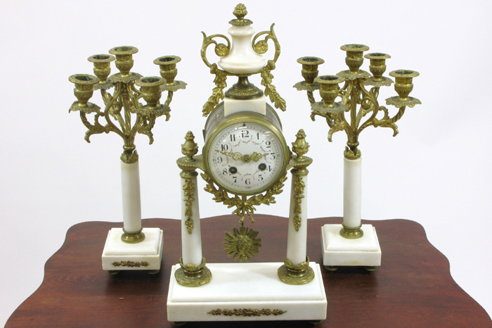 Appraisal: THREE-PIECE WHITE MARBLE BRASS AND GILT METAL PORTICO CLOCK SET