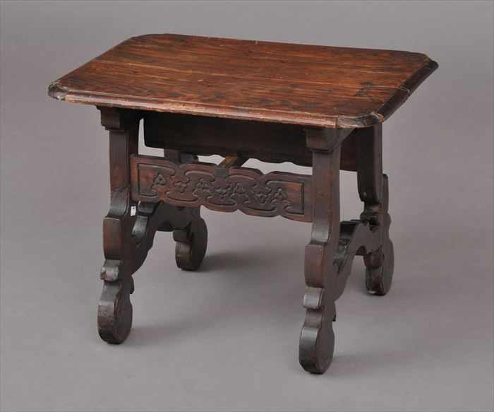 Appraisal: SPANISH BAROQUE-STYLE STAINED PINE LOW TABLE The shaped molded top