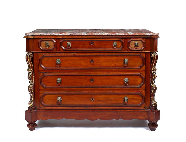 Appraisal: A CONTINENTAL WALNUT COMMODE with veined marble top the commode