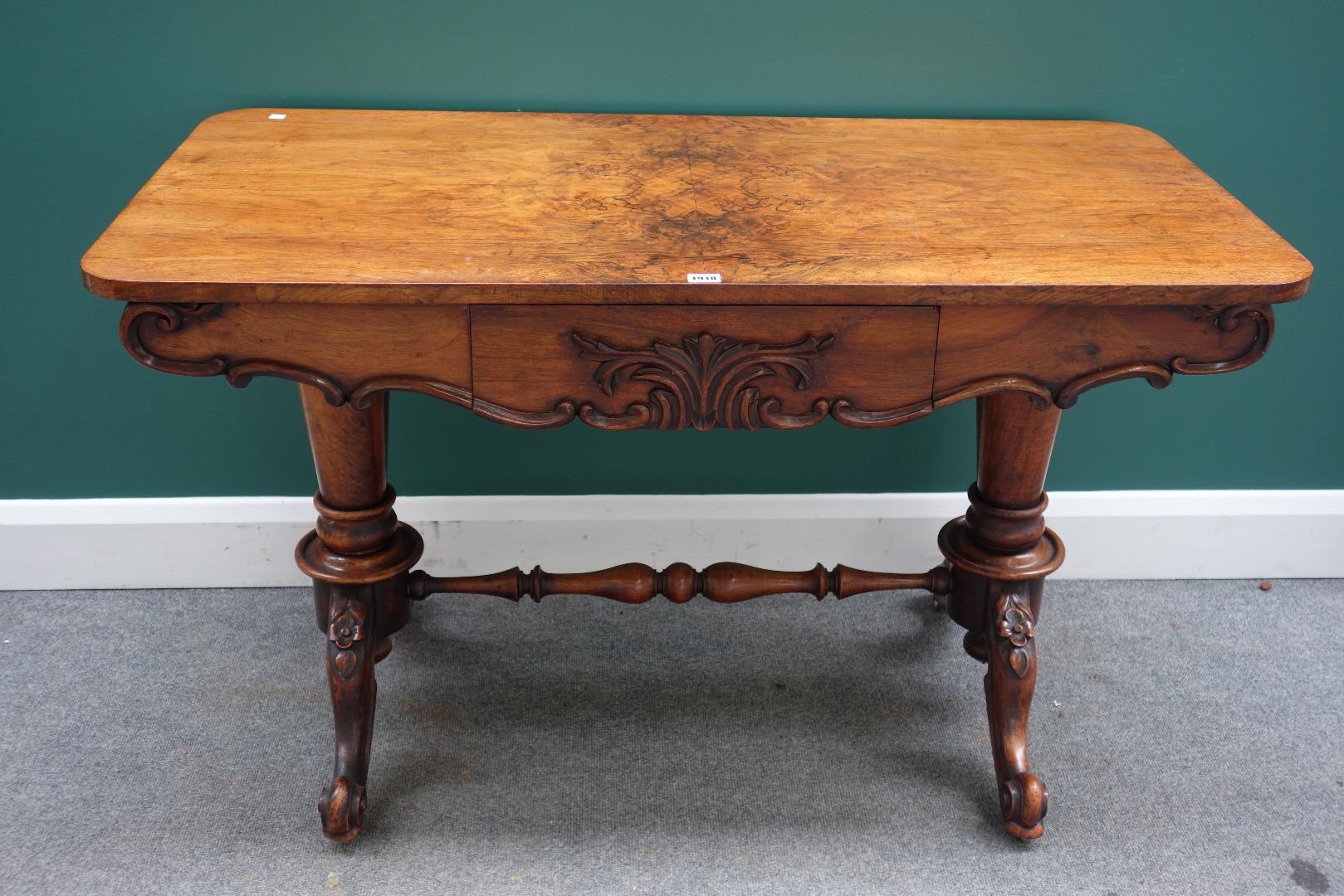 Appraisal: A Victorian figured walnut centre table the shaped frieze with