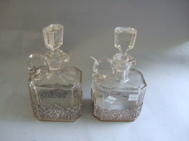 Appraisal: A pair of glass liqueur decanters with stoppers each with