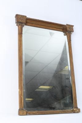 Appraisal: A Regency gilt framed mirror the bevelled glass flanked by