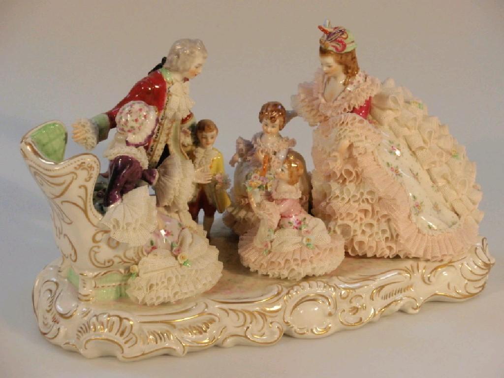 Appraisal: An Irish Dresden crinoline figure group entitled 'Grandmother's Birthday' cm