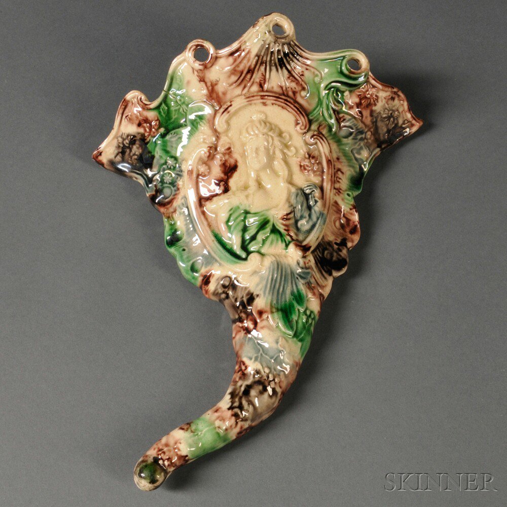 Appraisal: Staffordshire Cream-colored Earthenware Wall Pocket England c molded cornucopia form