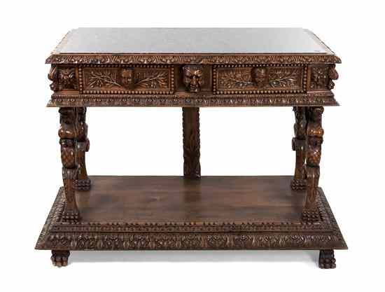 Appraisal: A Renaissance Revival Carved Server with a rectangular marble inset