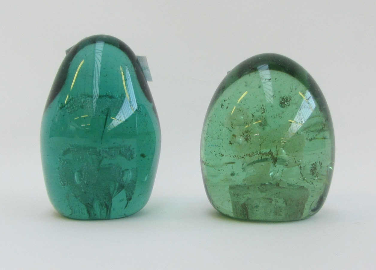 Appraisal: A quantity of Victorian and later green glass dump paperweights