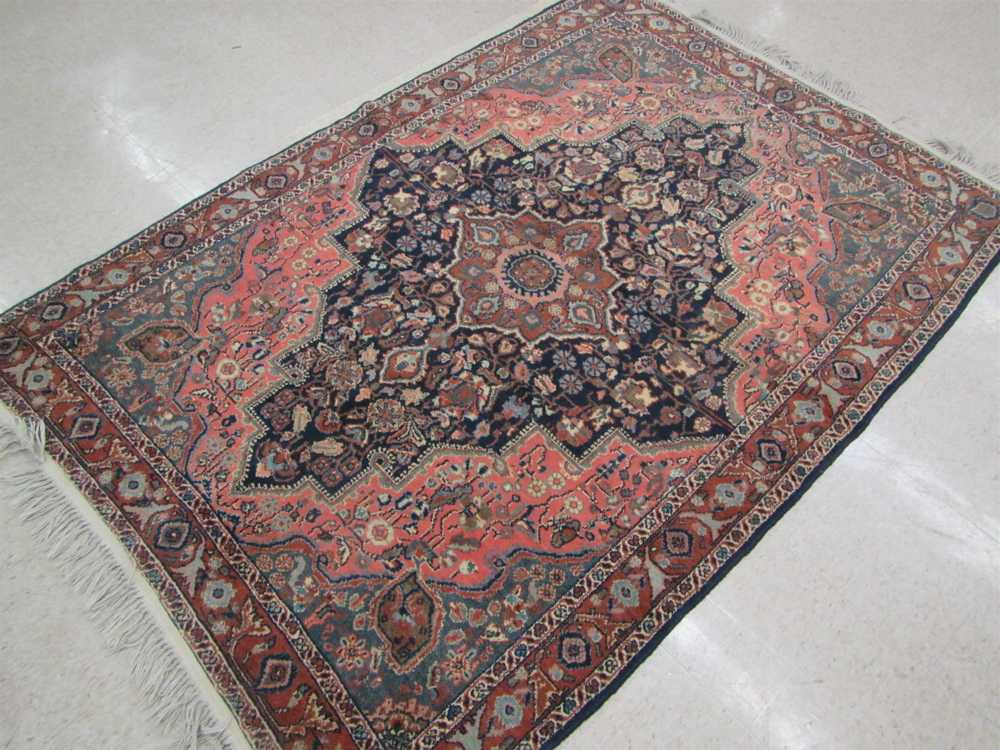 Appraisal: SEMI-ANTIQUE PERSIAN AREA RUG floral and central floral medallion design