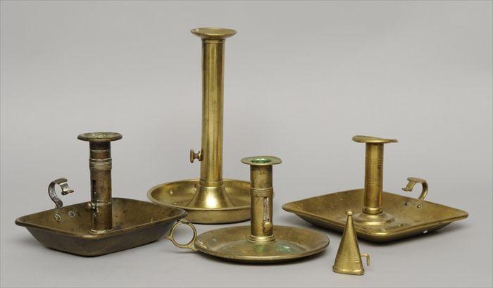 Appraisal: FOUR BRASS CHAMBERSTICKS Two with rectangular trays two with circular