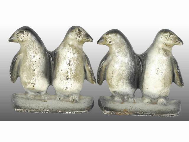 Appraisal: Double Penguins Cast Iron Bookends Description Made by Creations Co