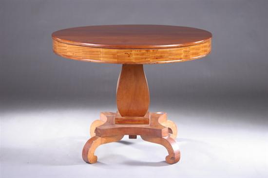 Appraisal: EMPIRE FRUITWOOD CENTER TABLE th century Circular plank-board top and