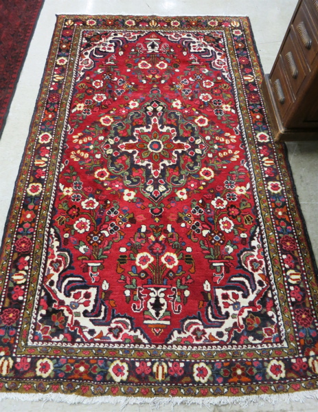 Appraisal: PERSIAN SEMI-ANTIQUE AREA RUG floral and central floral medallion design