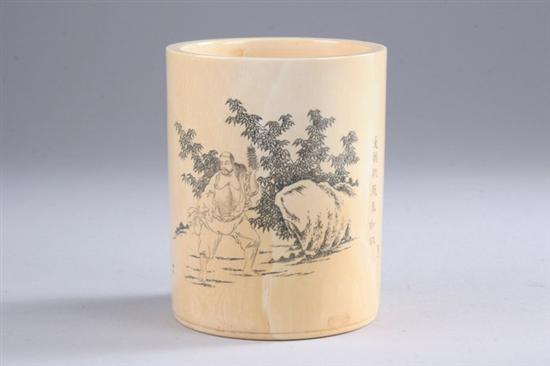 Appraisal: JAPANESE IVORY BRUSH POT Incised to depict man amongst rockwork