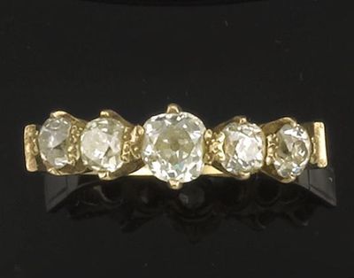 Appraisal: A diamond five stone ring The five graduated cushion shaped