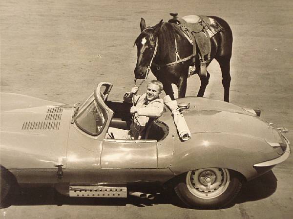 Appraisal: A publicity photograph of Steve McQueen in his Jaguar XK-SS