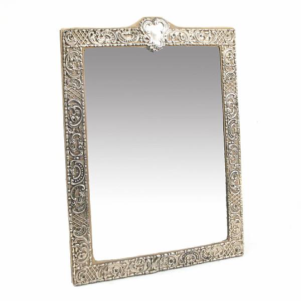 Appraisal: A sterling faced dressing table mirror Reticulated scroll and lattice