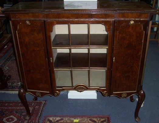 Appraisal: A s mahogany breakfront display cabinet the central glazed door