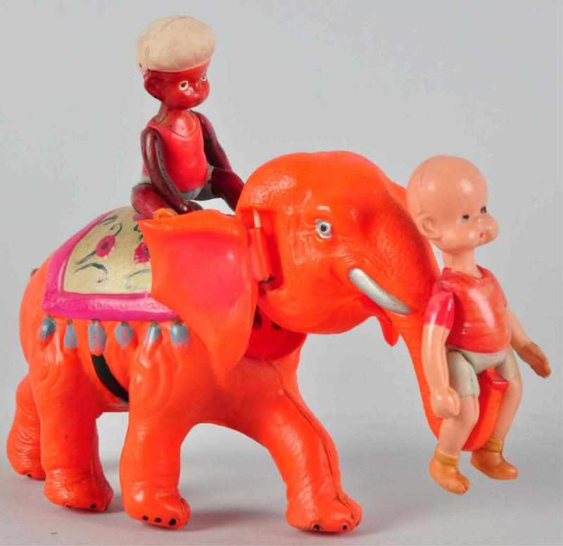 Appraisal: Celluloid Henry on Elephant Wind-Up Toy Japanese Working Pink elephant