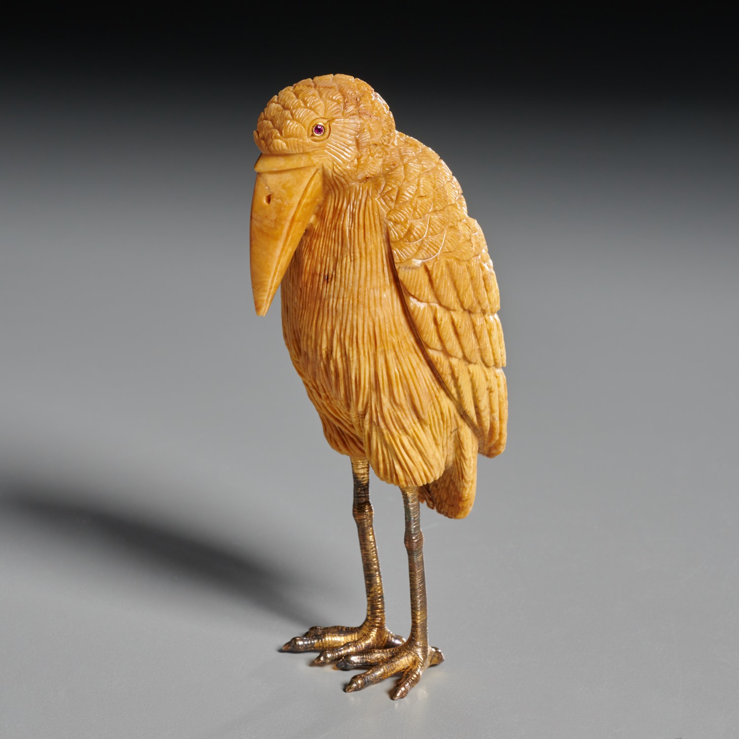 Appraisal: FABERGE HARDSTONE AND GILT BRONZE BIRD FIGURE th c carved