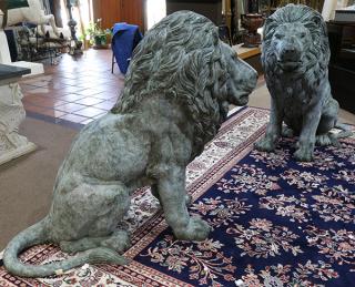 Appraisal: Pair of patinated bronze lions each having a verdis finish