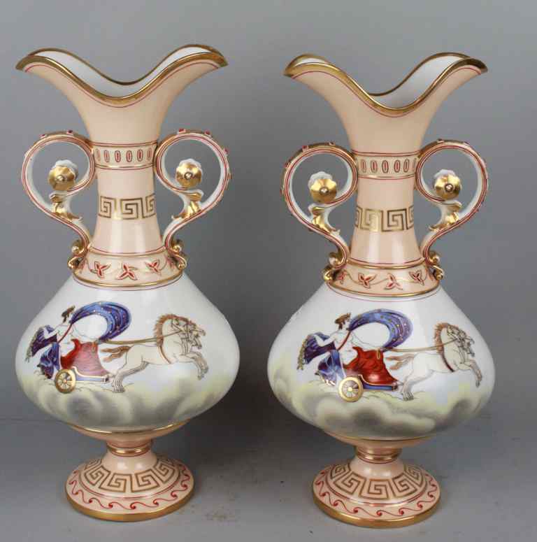 Appraisal: PAIR OF CONTINENTAL PORCELAIN TWO-HANDLED VASES with narrow flaring shaped