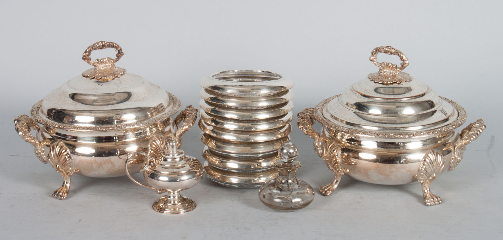 Appraisal: Pair of silver-plated sauce tureens coasters tureens - repousse decoration