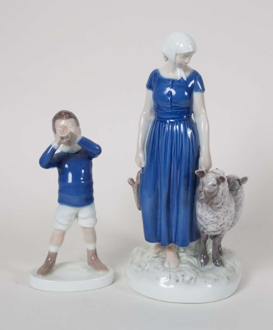 Appraisal: Two Bing Grondahl porcelain figures including boy blowing horn in