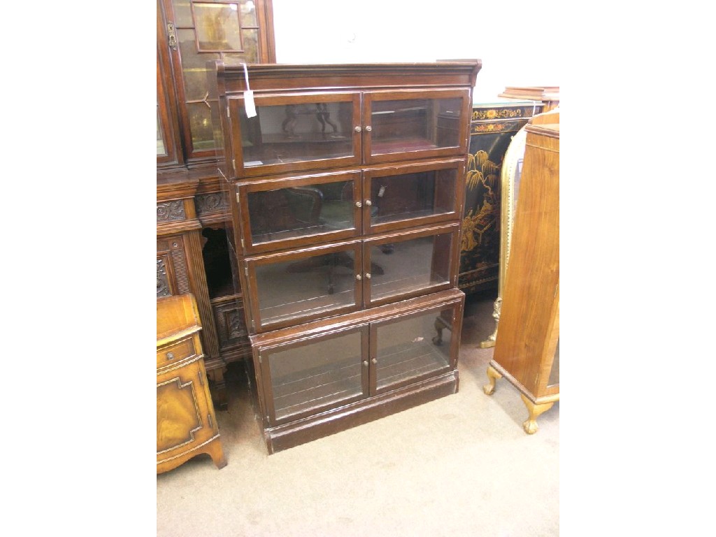 Appraisal: A Minty's mahogany sectional bookcase four glazed sections each with