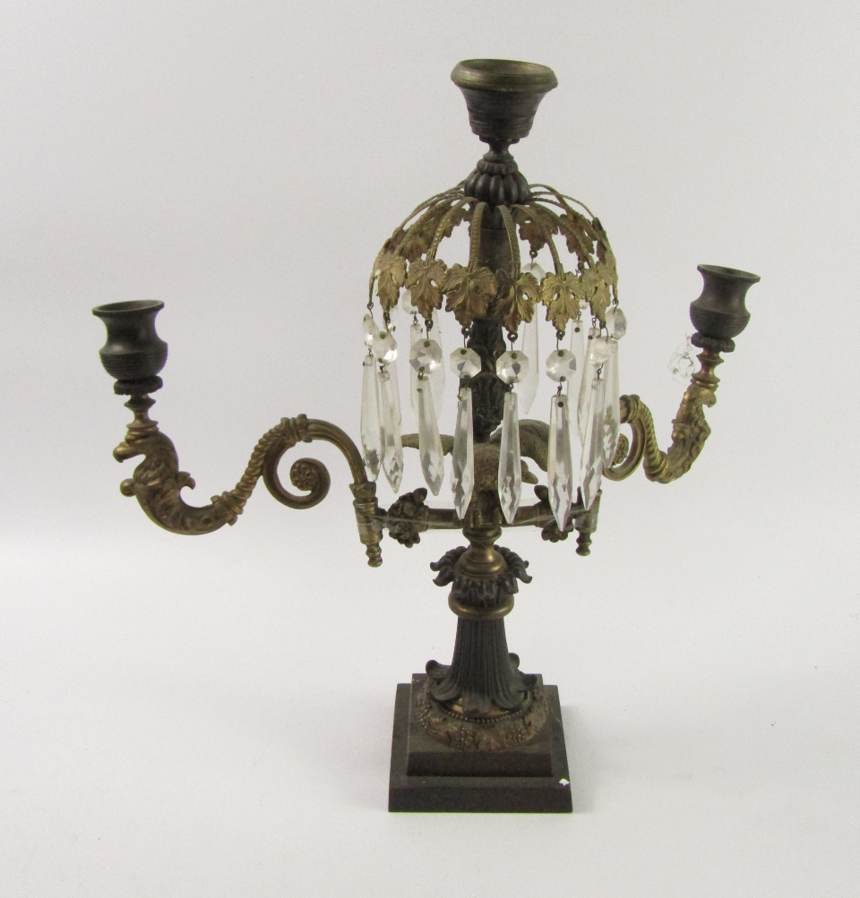 Appraisal: A French late thC bronze and brass three branch candelabrum