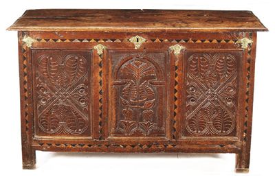 Appraisal: An oak coffer the twin plank moulded edge hinged top