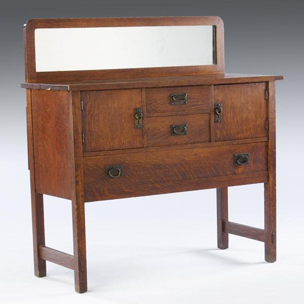 Appraisal: GUSTAV STICKLEY Sideboard with mirrored back fastened with butterfly joints