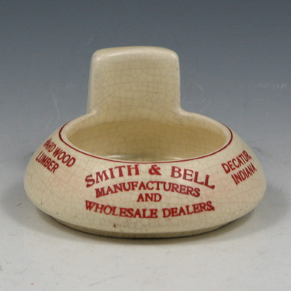 Appraisal: Roseville Creamware Advertising ashtray for Smith Bell Manufacturers and Wholesale