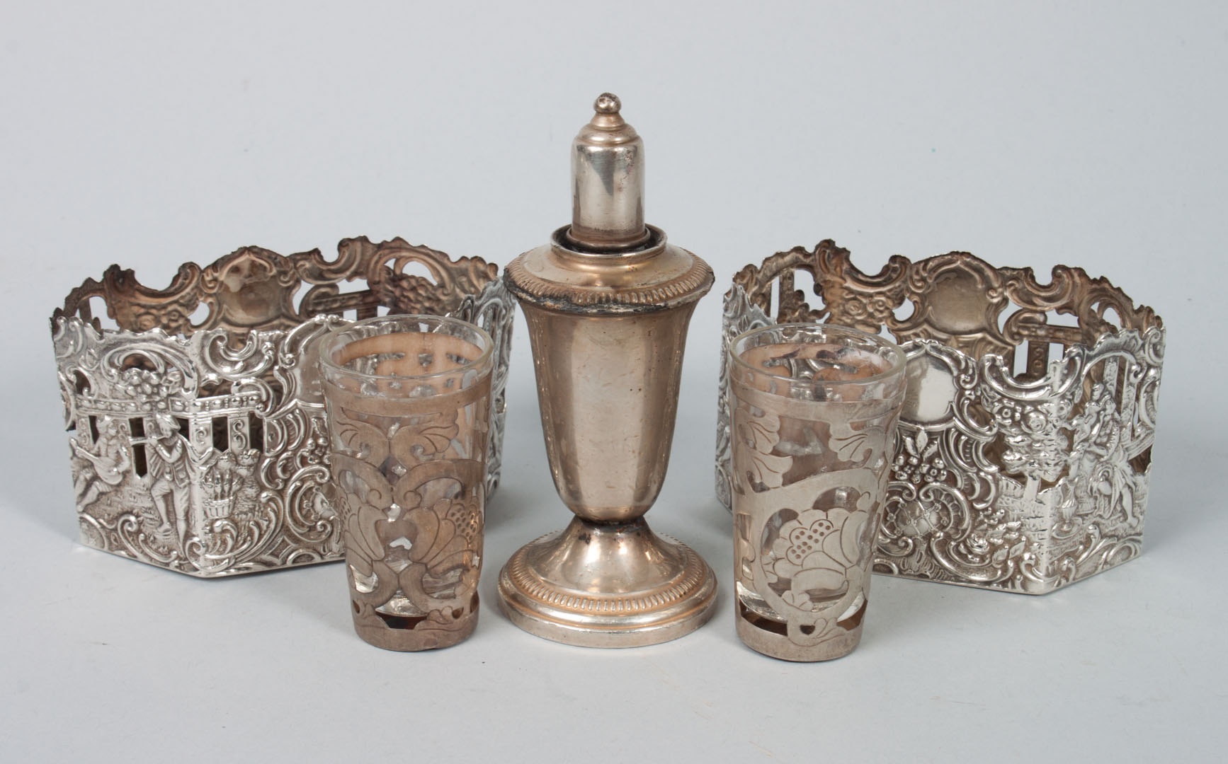 Appraisal: Pair of continental sterling decanter sleeves together with two Mexican