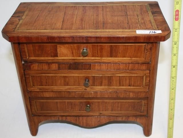 Appraisal: TH C MINIATURE DRAWER CHEST POSSIBLY FRENCH WALNUT WITH EXOTIC