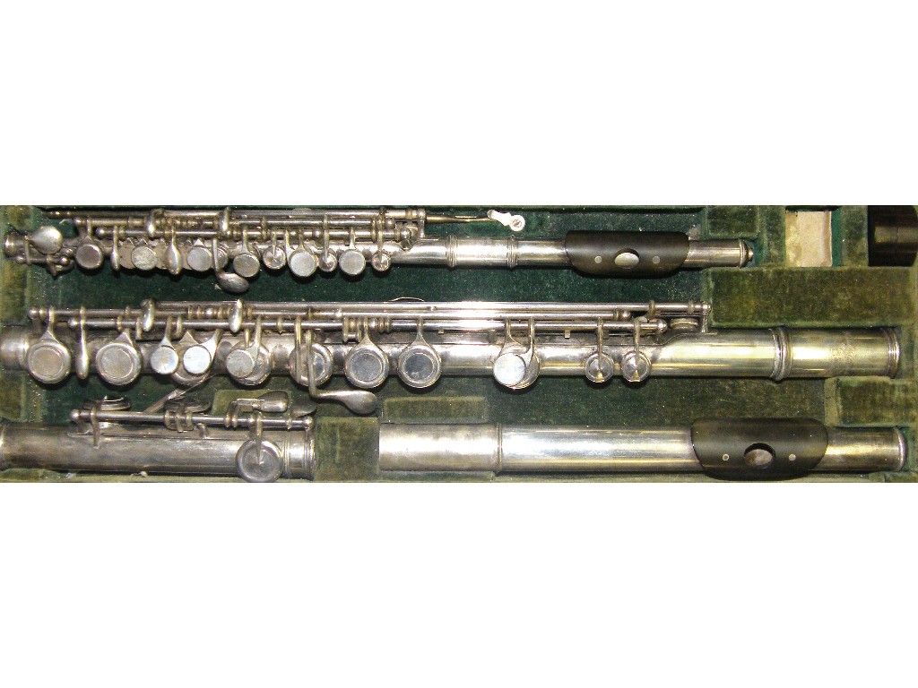 Appraisal: Solid silver system flute and matching piccolo inscribed Rudall Carte