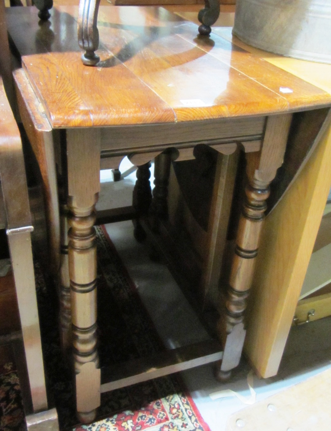 Appraisal: A th century oak drop-flap table