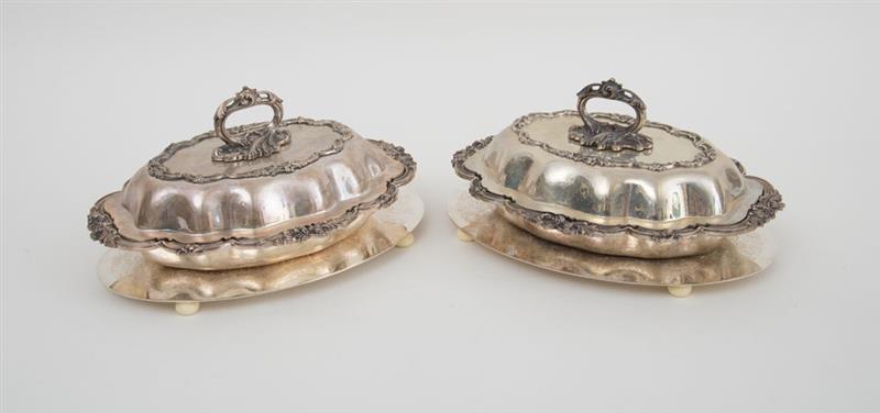 Appraisal: PAIR OF ENGLISH SILVER-PLATED ENTREE DISHES AND COVERS AND A