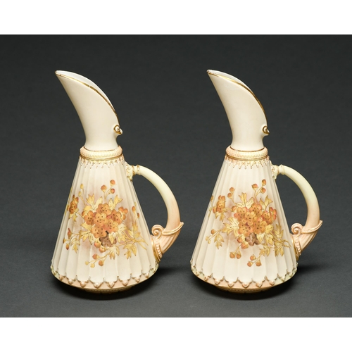 Appraisal: A pair of Royal Worcester fluted ewers decorated in predominately