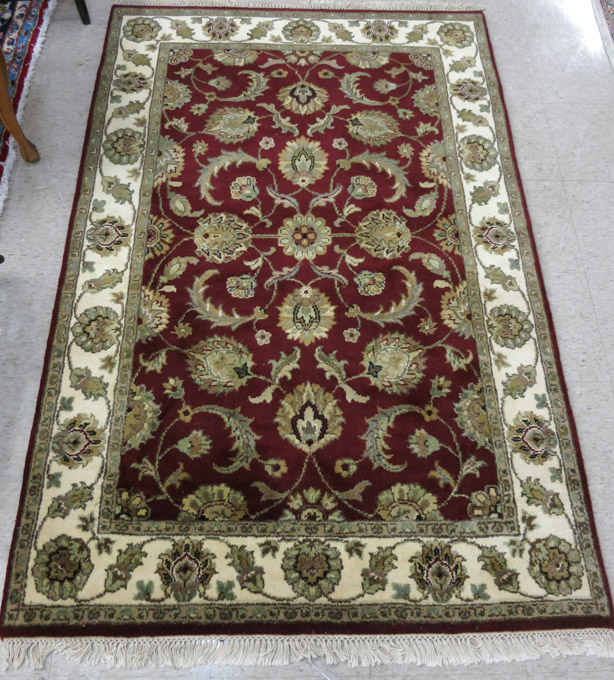 Appraisal: HAND KNOTTED ORIENTAL AREA RUG Indo-Persian overall floral design on