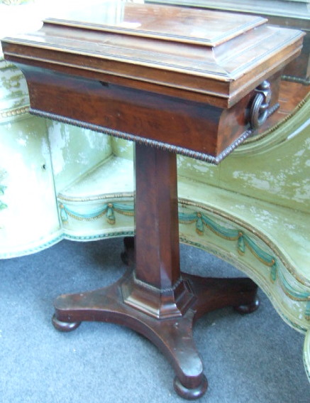 Appraisal: A George IV mahogany teapoy the sarcophagus shaped top with