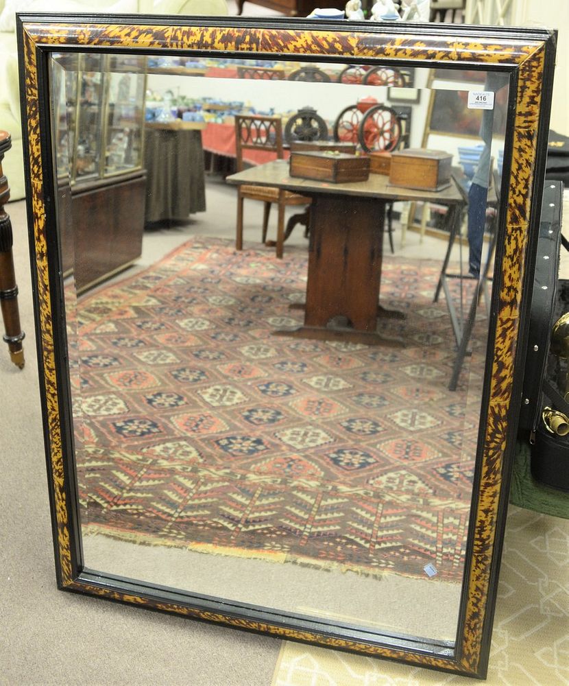 Appraisal: Baroque Style Ebonized and Faux Tortoiseshell Painted Rectangular Mirror having