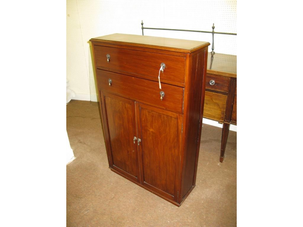 Appraisal: A mahogany side cupboard with two drawers ft in