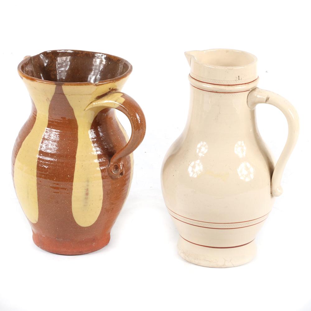 Appraisal: TWO ANTIQUE POTTERY PITCHERS GREENFIELD VILLAGE PENNSYLVANIA REDWARE WITH YELLOW